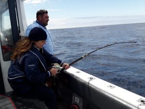 Woman catching Yellowfin